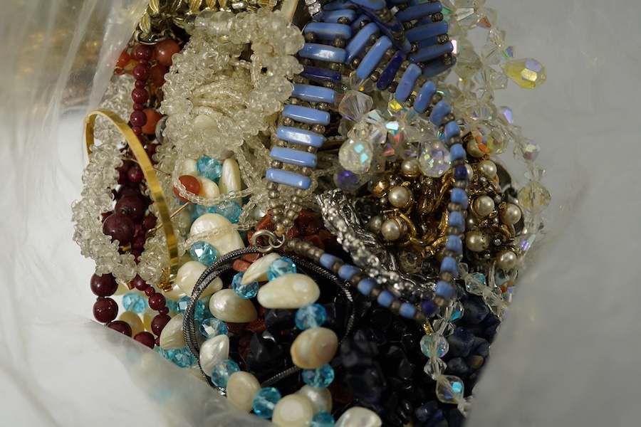 Four large bags of assorted costume jewellery including, brooches, necklaces, bangles, etc. Condition - poor to fair to good